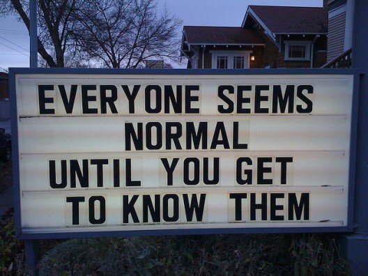 Sign reads Everyone Seems Normal Until You Get to Know Them
