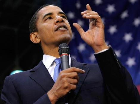 President Obama points upward during a speech