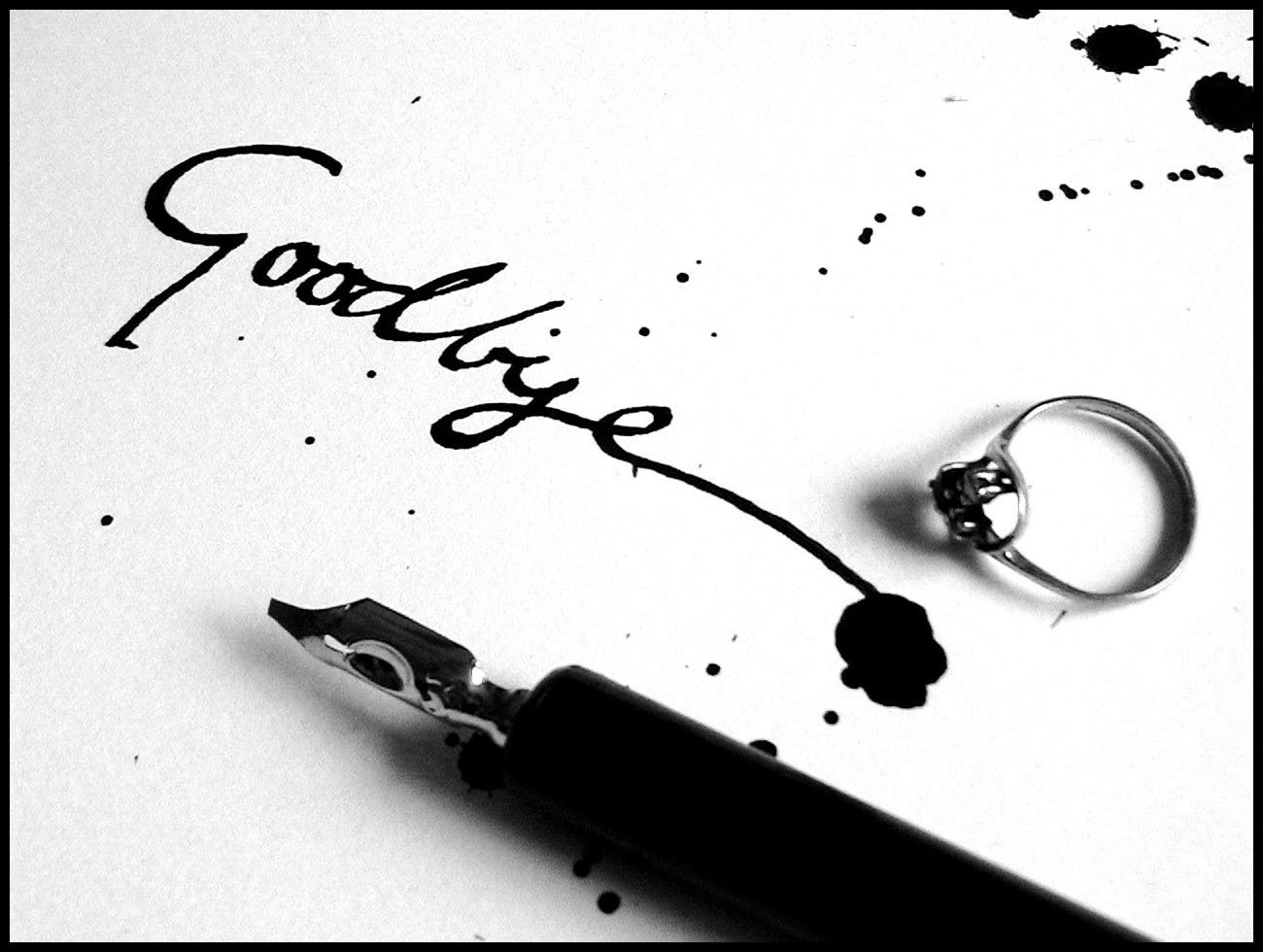 Foutain ink pen with ring on paper reading Goodbye