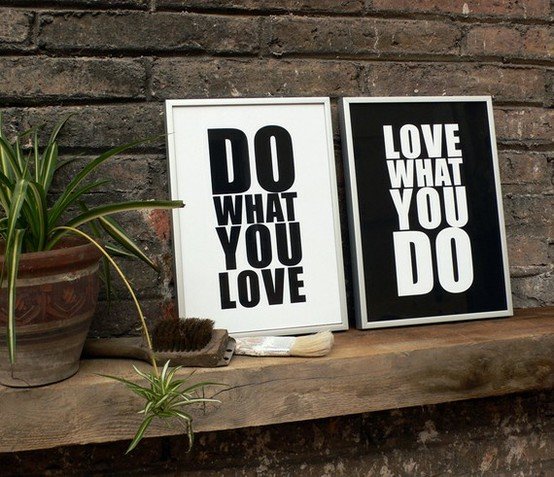 White and black alternating signs with quotes with brick background