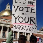 Man holds sign reading Did We Vote on Your Marriage? at gay marriage protest
