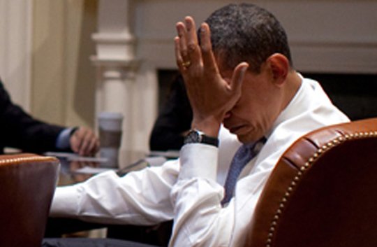 Obama palms his face under stress