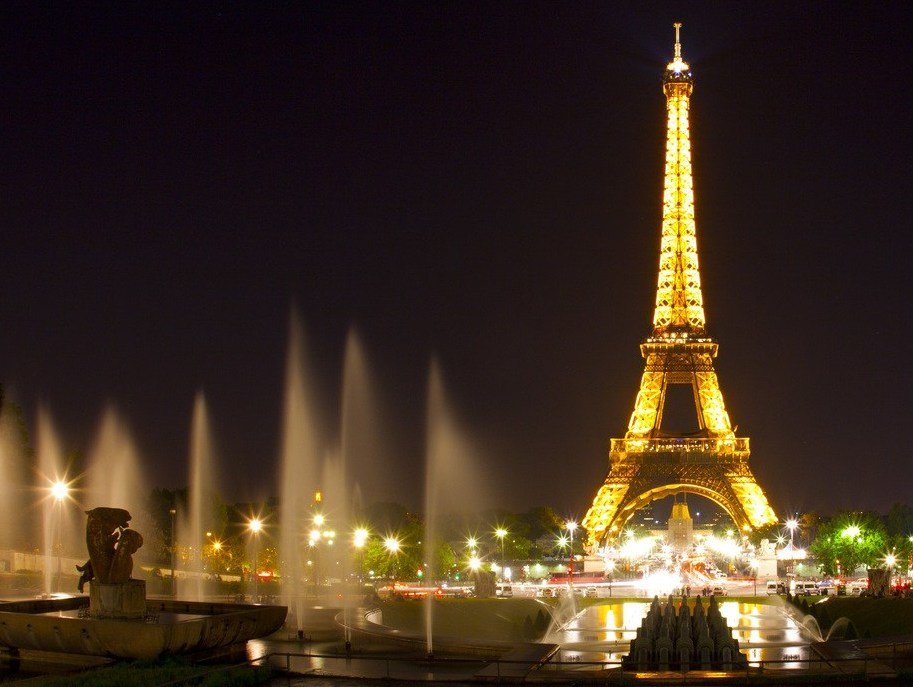Scenic view of the Eiffel Tower lit up at night in Paris