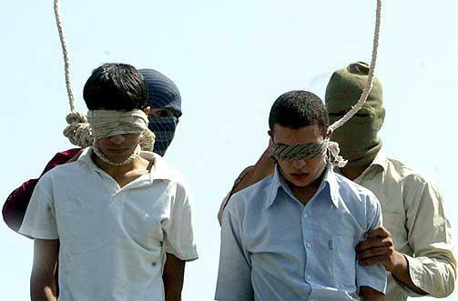 Two young men prepare to be hanged while blindfolded