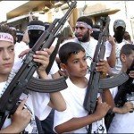 Young kids hold rifles in unision