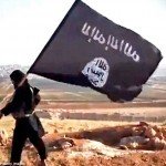 Person carrying ISIS flag walking the desert