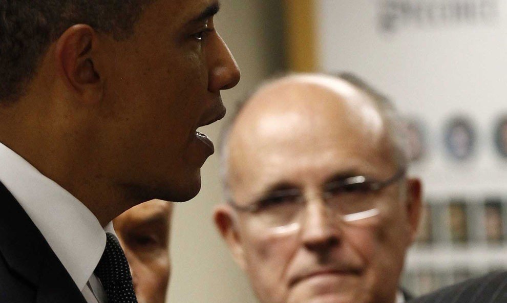 Closeup sideview of Obama speaking with Giuliani in background