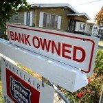 Sign on house that reads Bank Owned