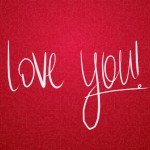 Cursive words read I love you! on a red background