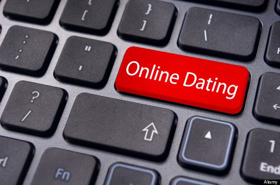 Red button on keyboard reads Online Dating