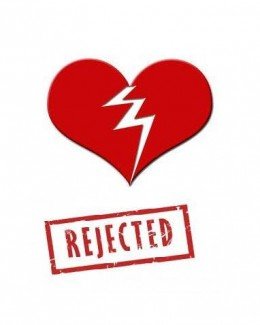 Drawn red heart broken in half with the word Rejected stamped below it