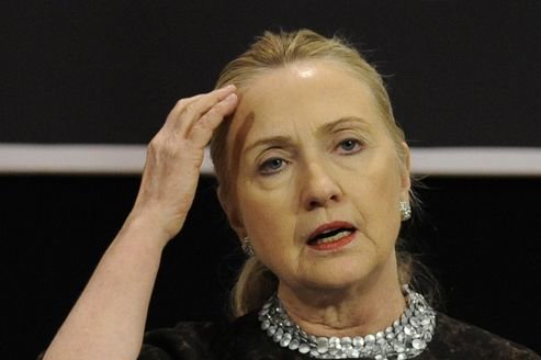 Hillary Clinton scratches head with dumbfounded look on face