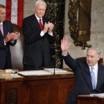 Netanyahu waves as two others clap behind him