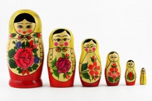 Nesting dolls lined up in order from biggest to smallest