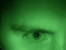Green image of a closeup of an eye