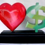 Red heart with green dollar symbol decor statues