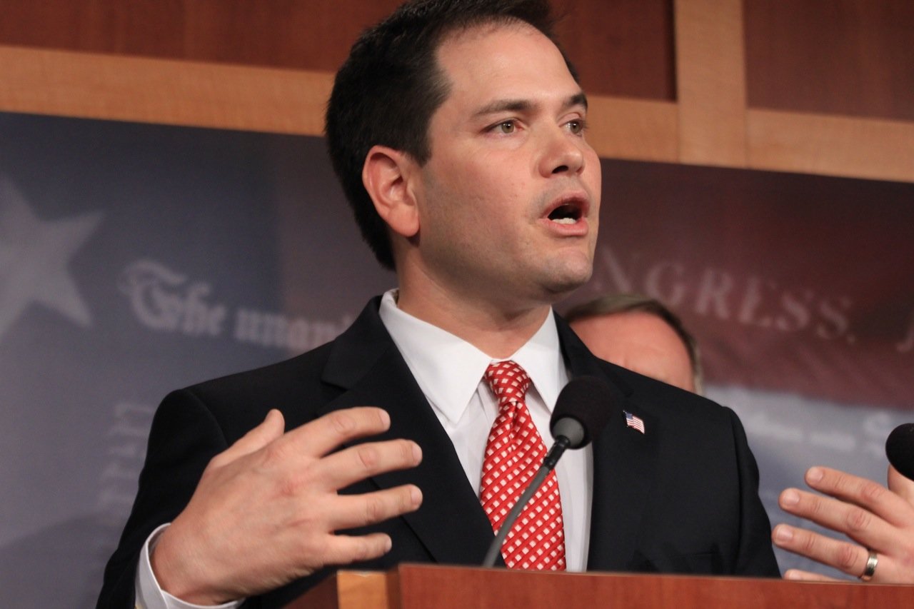 Marco Rubio gives speech at podium with hand gestures