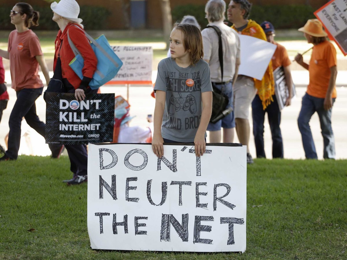Young child holds sign at protest that reads Don't Neuter the Net