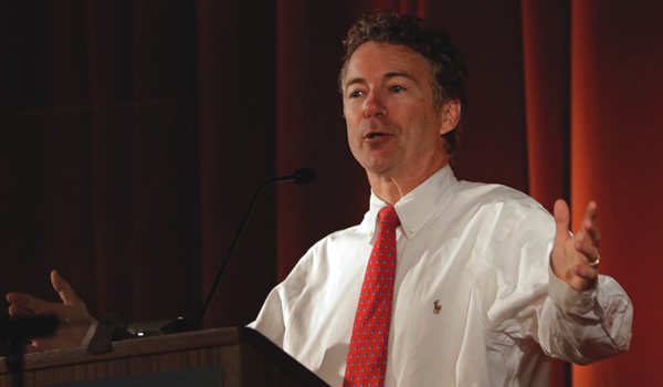 Rand Paul giving speech wearing white shirt with red dotted tie