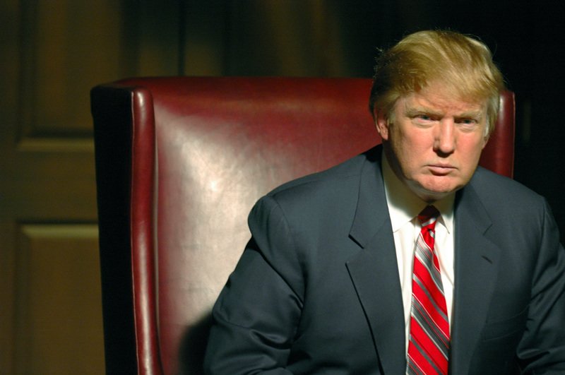 Donald Trump sits in red chair for NBC series The Apprentice