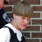 Dylann Roof, shooter of Charleston church, escorted by cop wearing bulletproof vest