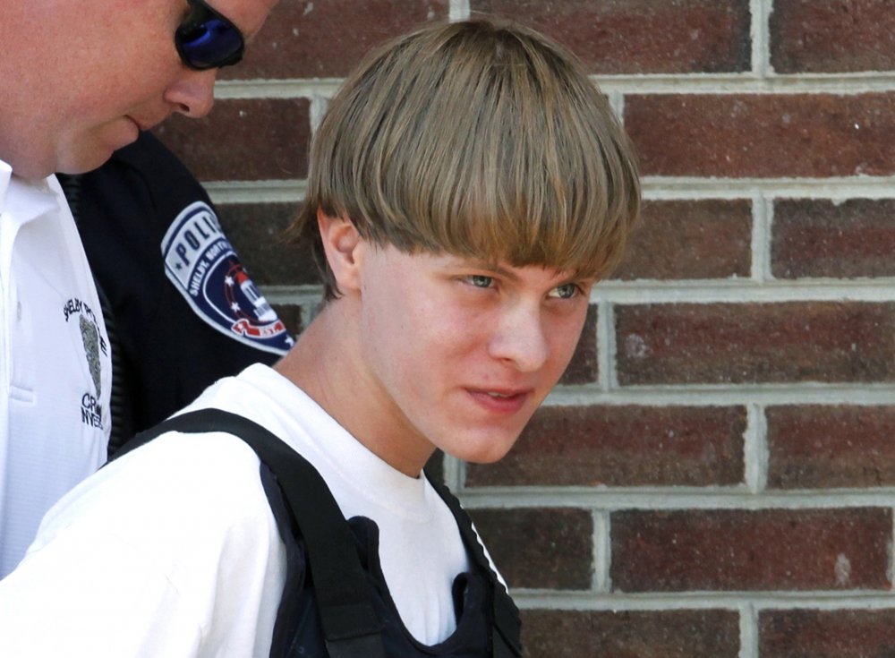 Dylann Roof, shooter of Charleston church, escorted by cop wearing bulletproof vest