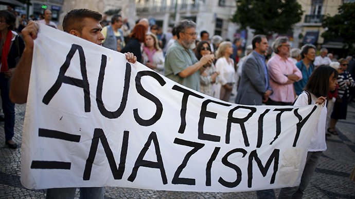 Protestors hold banner that reads Austerity = Nazism