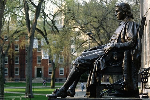 Side view of John Harvard statue