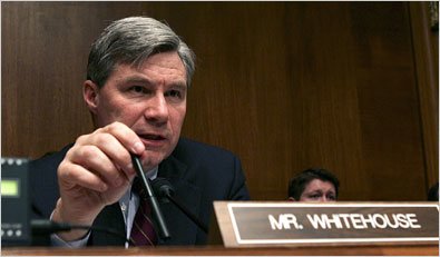 Politician Sheldon Whitehouse at conference with name plaque