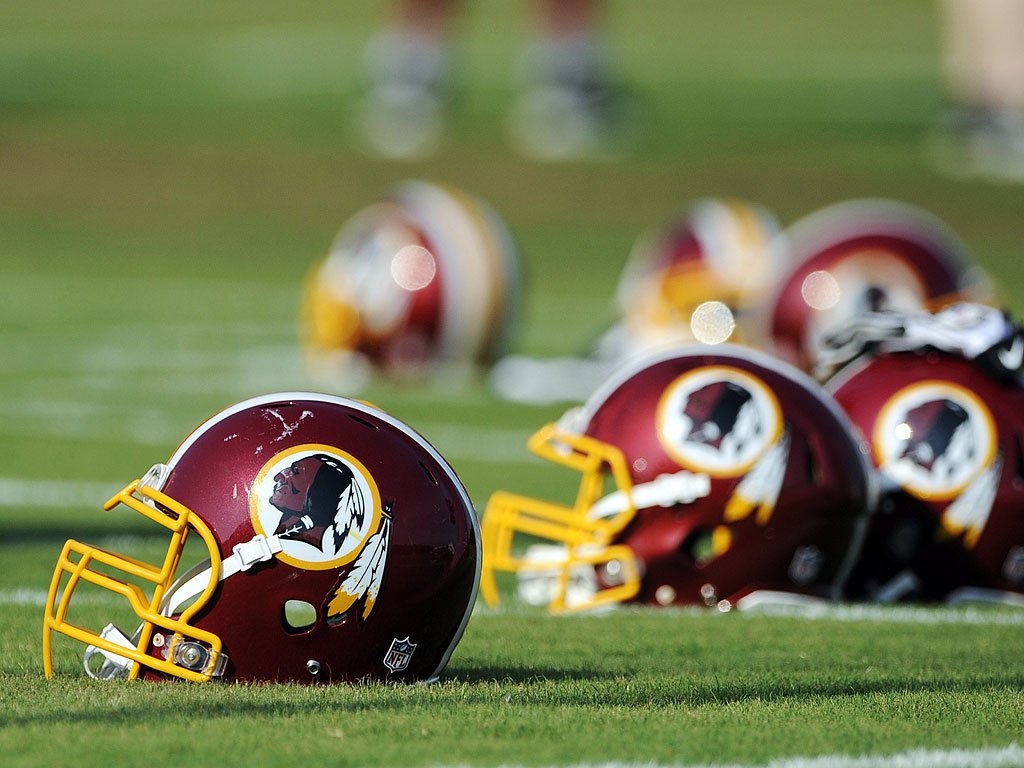 Helmets of the Washington Redskins on football field