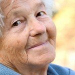 Senior aged woman smiles
