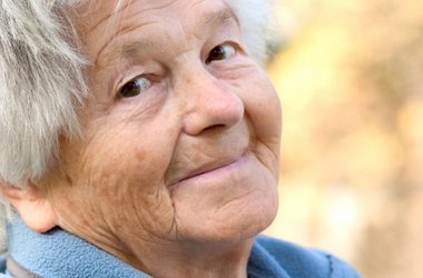Senior aged woman smiles