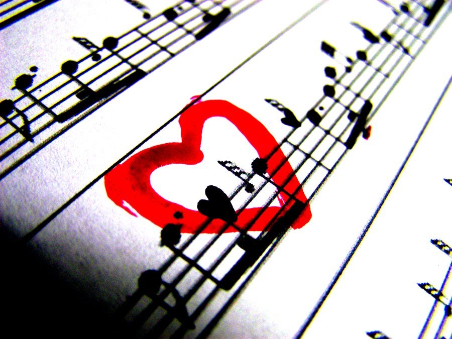 Sheet music with a red heart drawn over music notes