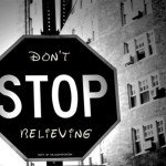 Black and white image of stop sign reads Don't STOP Believing